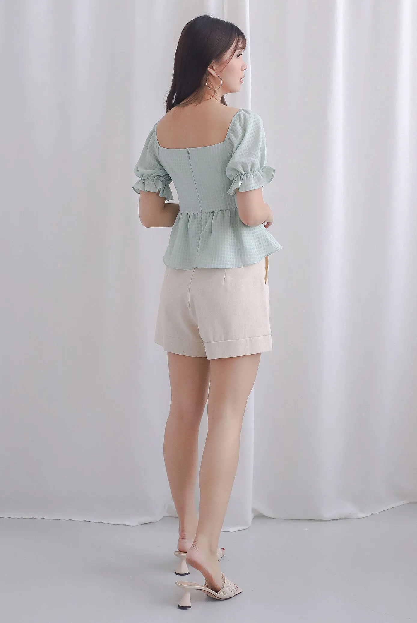 Enysa Gingham Sleeve Peplum Top In Pistachio