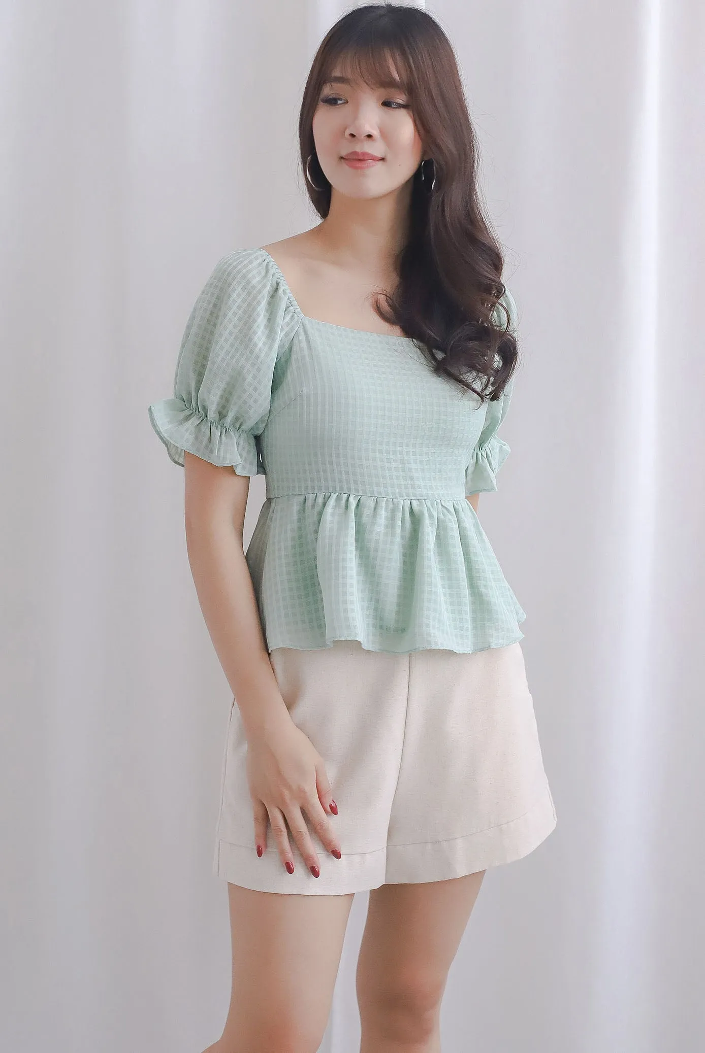 Enysa Gingham Sleeve Peplum Top In Pistachio