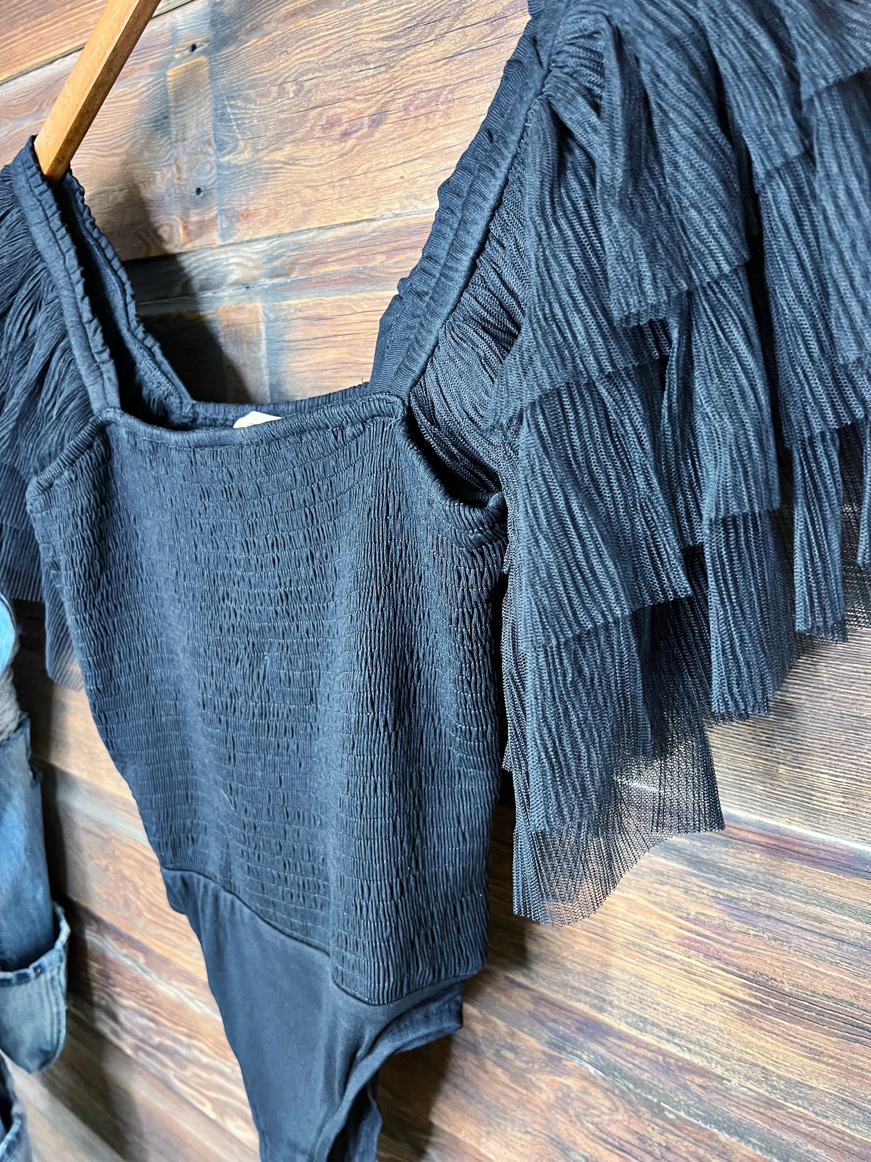The Ruffle Sleeve Bodysuit in Black